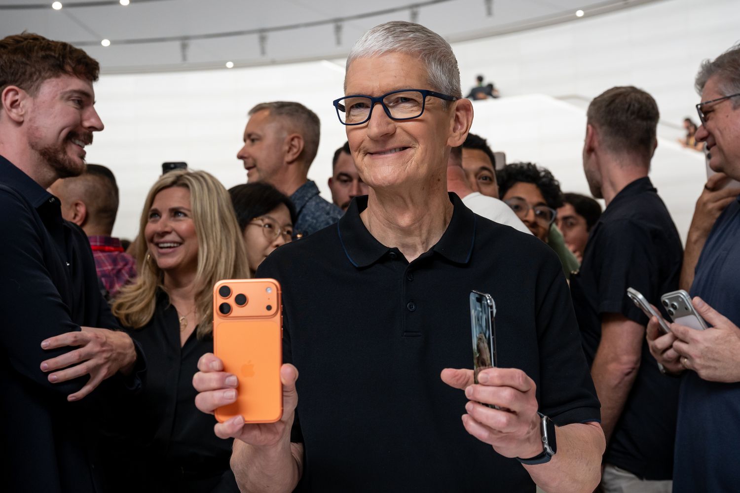 Tim Cook, chief executive officer of Apple Inc., holds the Apple iPhone 17 Pro, left, and iPhone Air during an event at Apple Park campus in Cupertino, California, US, on Tuesday, Sept. 9, 2025.